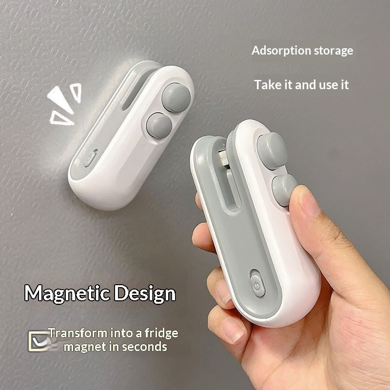 White portable bag sealer with two buttons, held in hand for heat sealing