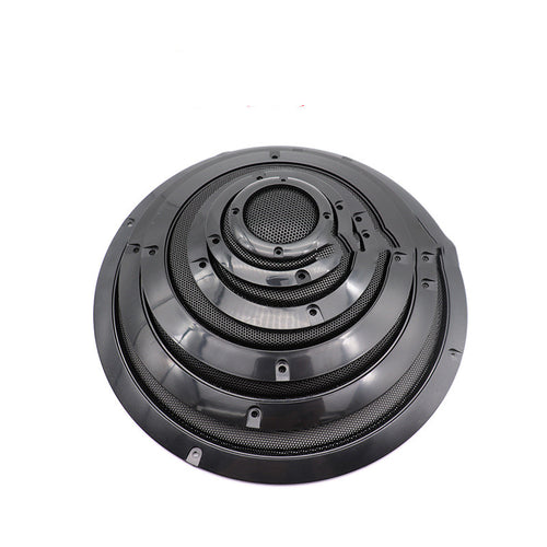 Car speaker grille mask with round black housing, mesh screen, and mounting tabs.