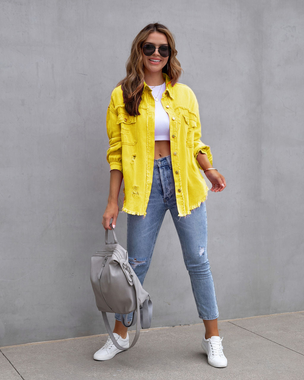 Yellow ripped denim shirt jacket with button front and chest pockets