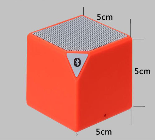 Orange Rubik's Cube Bluetooth speaker with top grille and Bluetooth icon