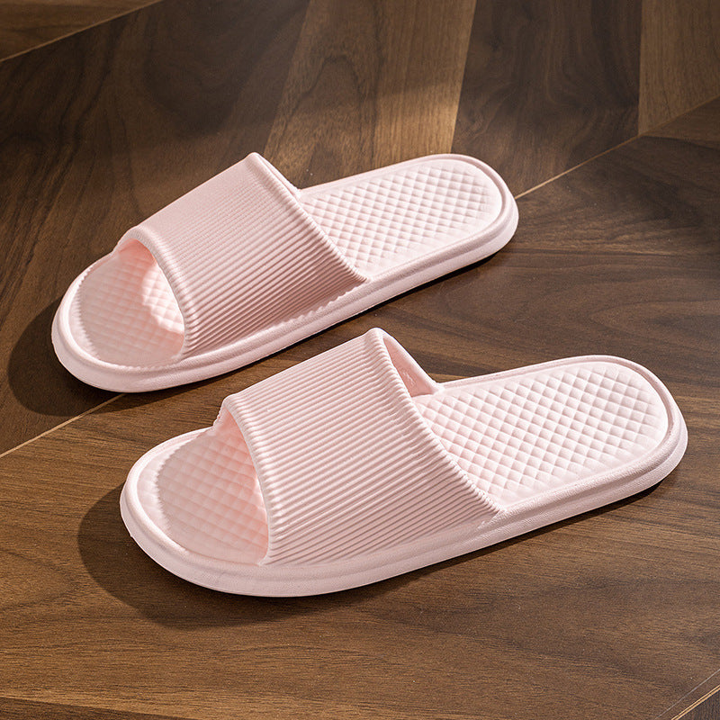 Pink slide slippers with striped strap and textured diamond footbed