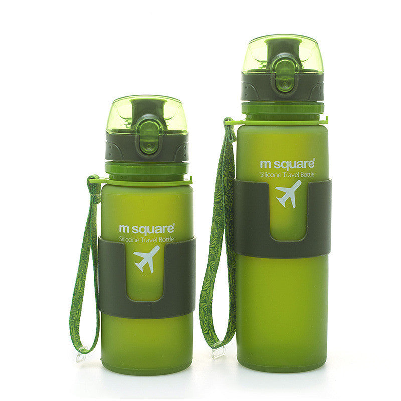 Set of two green silicone travel bottles with carry straps and flip-up spouts