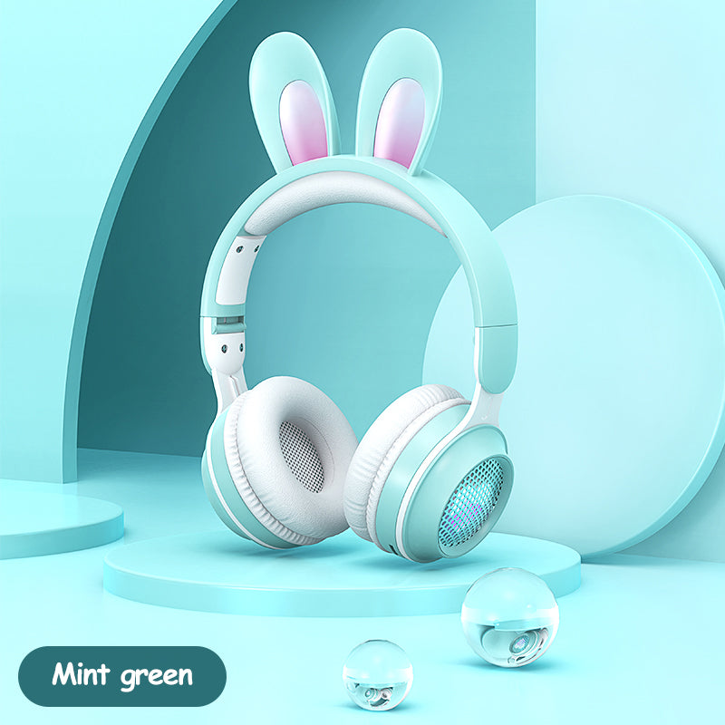 Rabbit-ear over-ear headphones with mint green headband and soft ear pads, glowing design