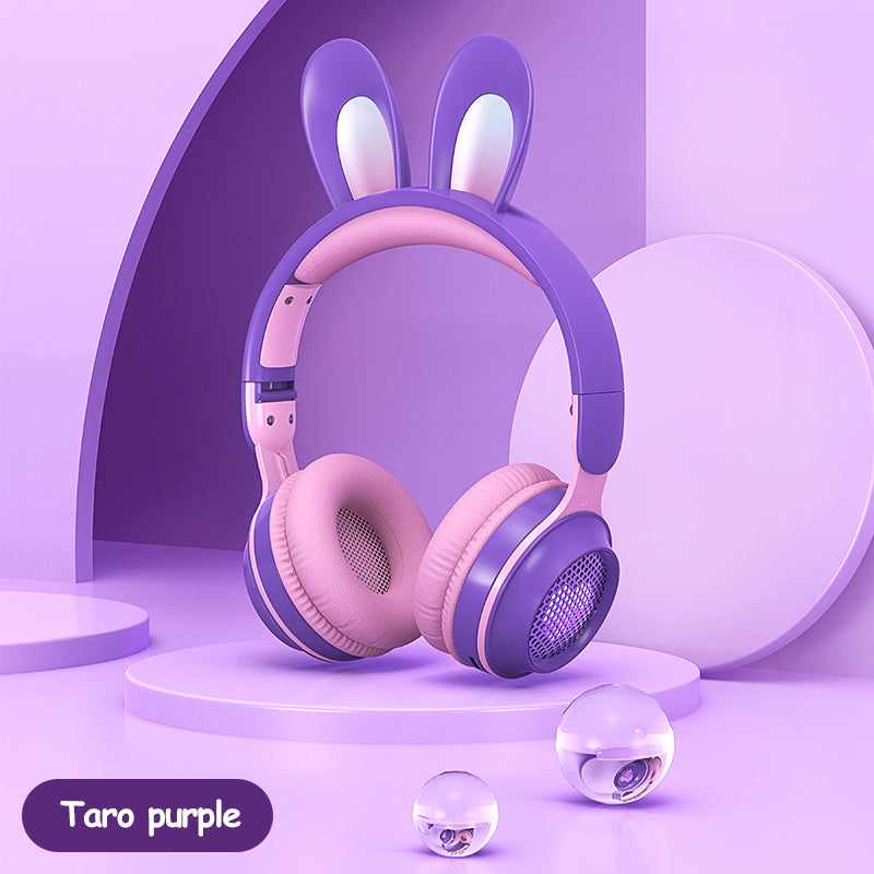 Purple rabbit-ear wireless headphones with padded over-ear cups and glowing speaker grill