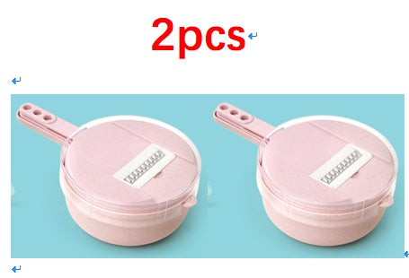 Two pink mandoline slicers with grating inserts, shown side by side for quantity.