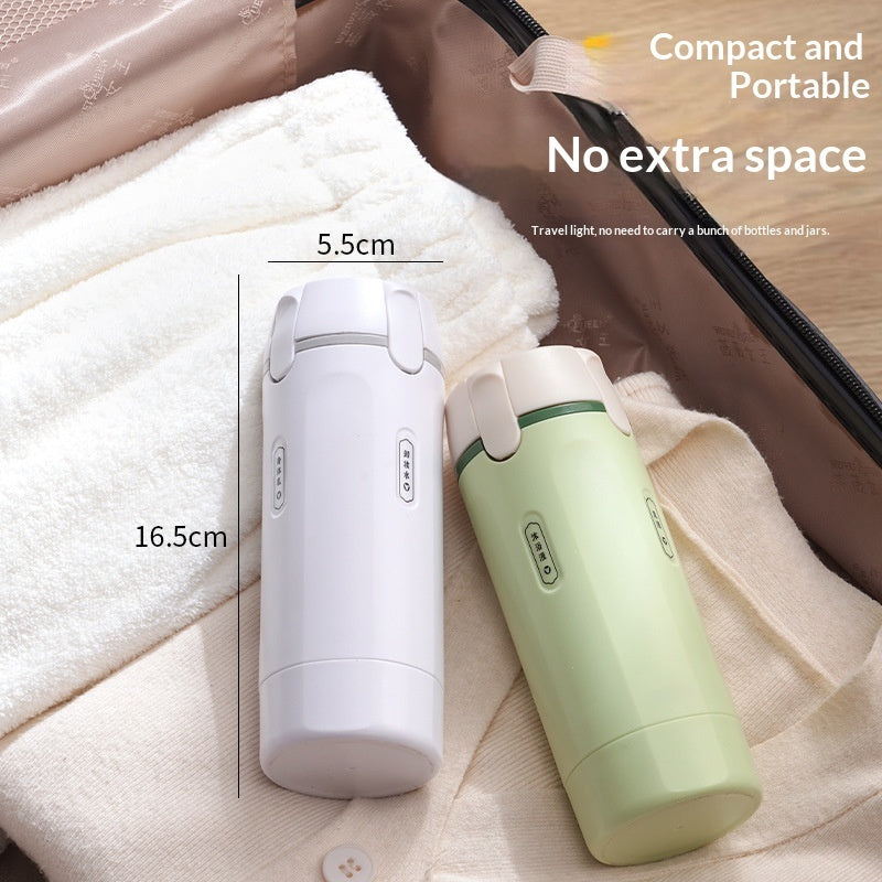 Compact 4-in-1 travel dispenser bottle, white and light green on a folded towel