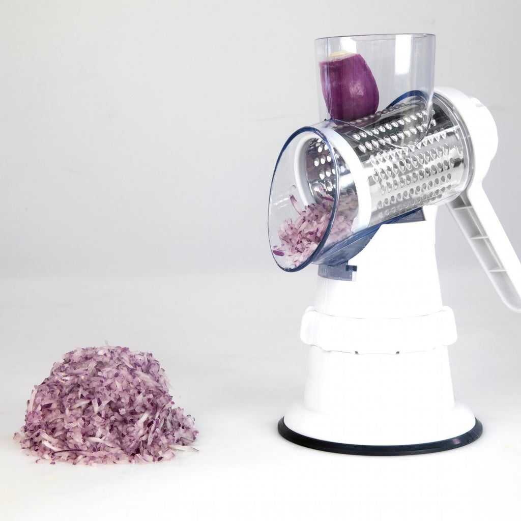 White 3-in-1 vegetable slicer with grater drum and shredded purple vegetables