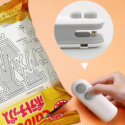 Handheld white heat sealer with vacuum mouth, held near chip bag opening